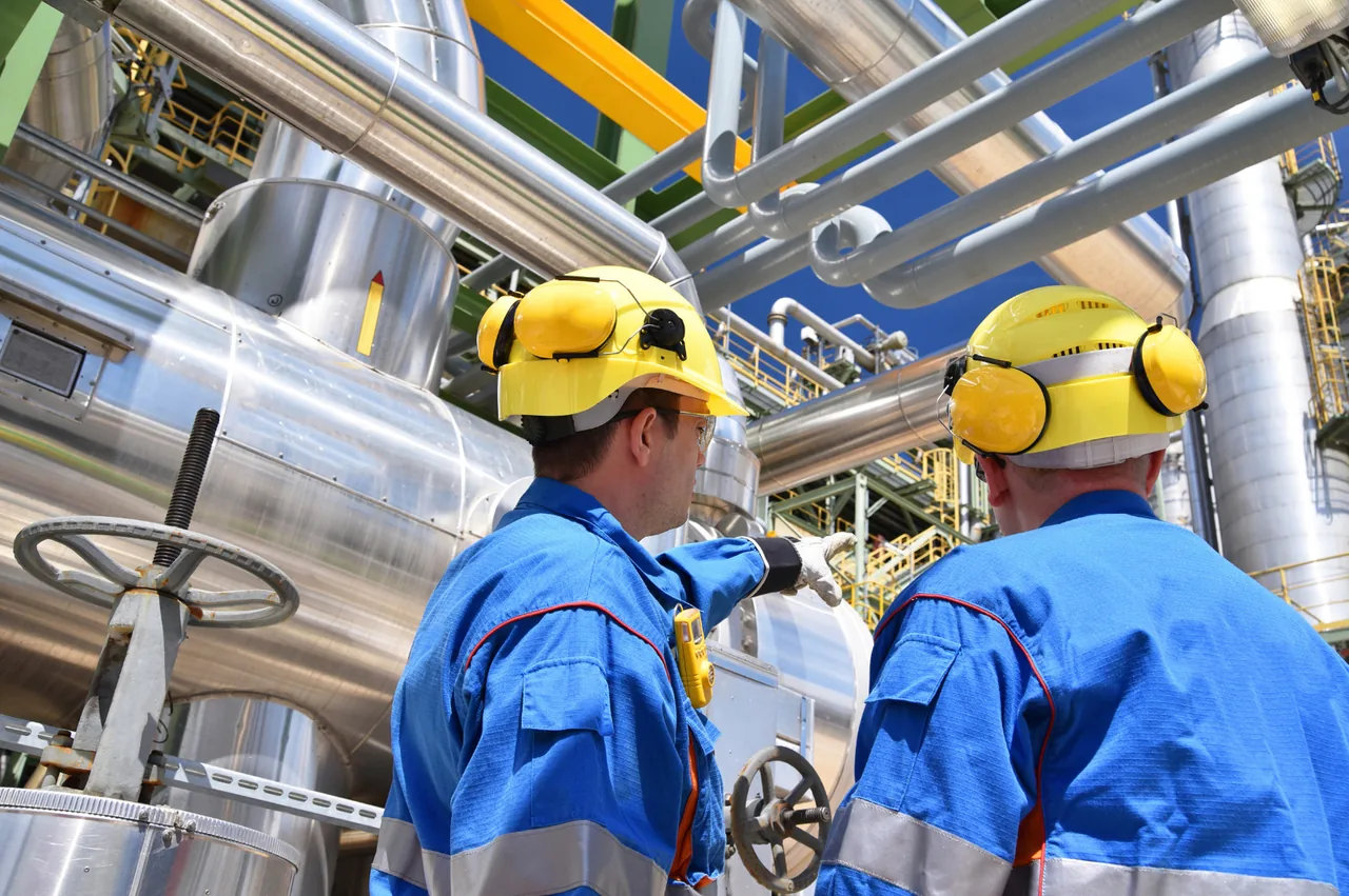 Maintenance team inspecting industrial equipment